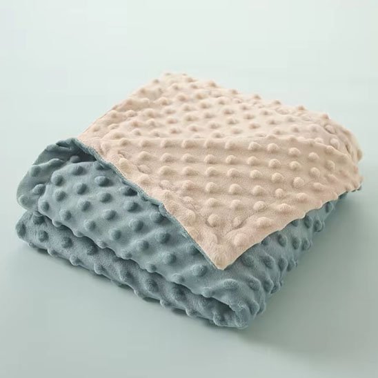 Couverture bébé plié une couleur de chaque côté
